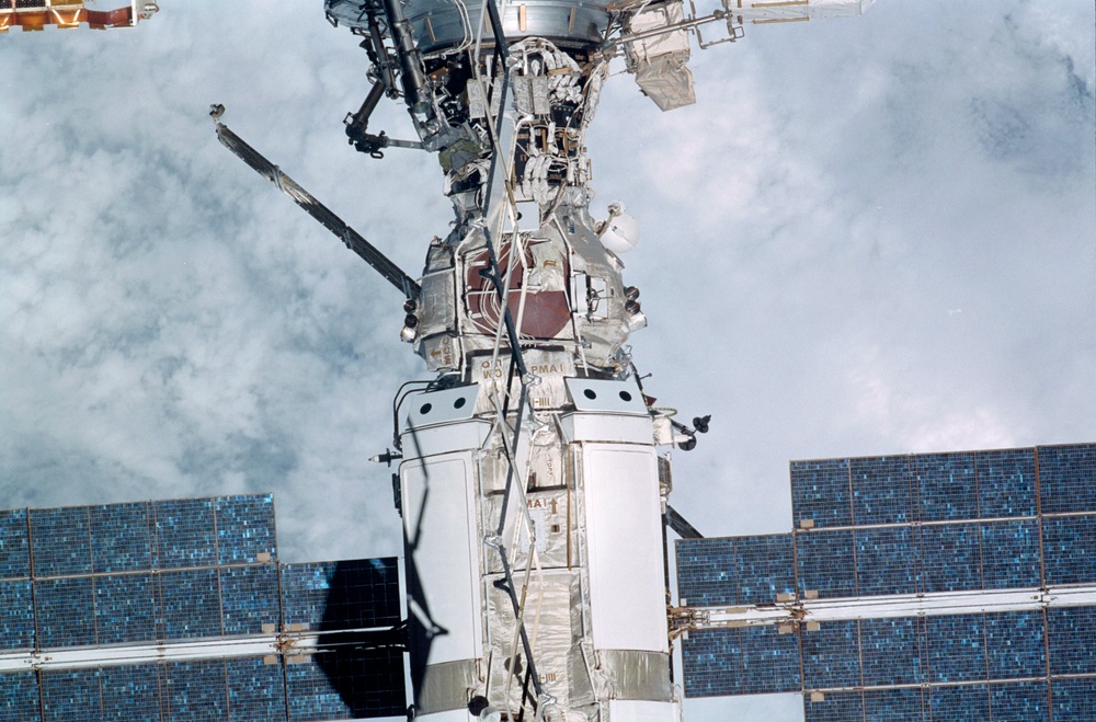 Exterior view of ISS during flyaround by STS-105 showing FGB and PMA1