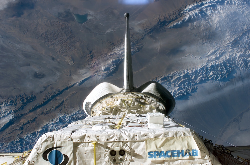 Spacehab in Columbia's PLB backdropped against the Earth during STS-107