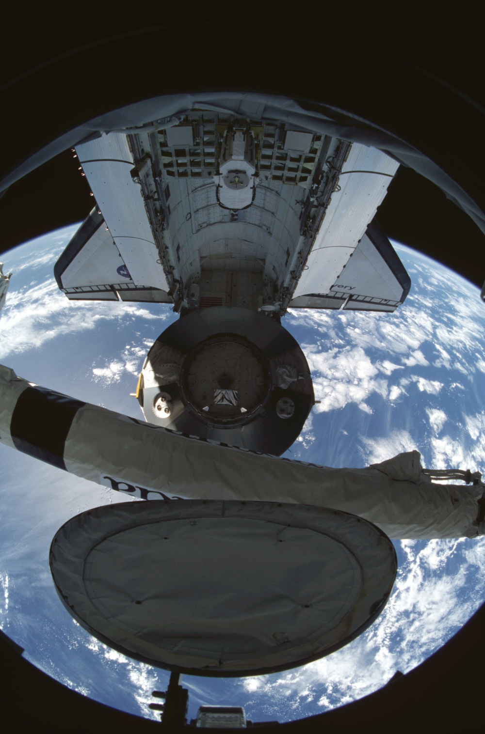 MPLM/Leonardo is lifted from the orbiter payload bay