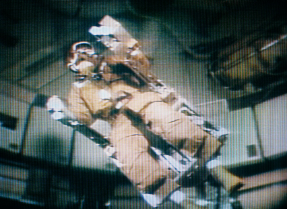 Astronaut Alan Bean flies the Astronaut Maneuvering Equipment in the OWS