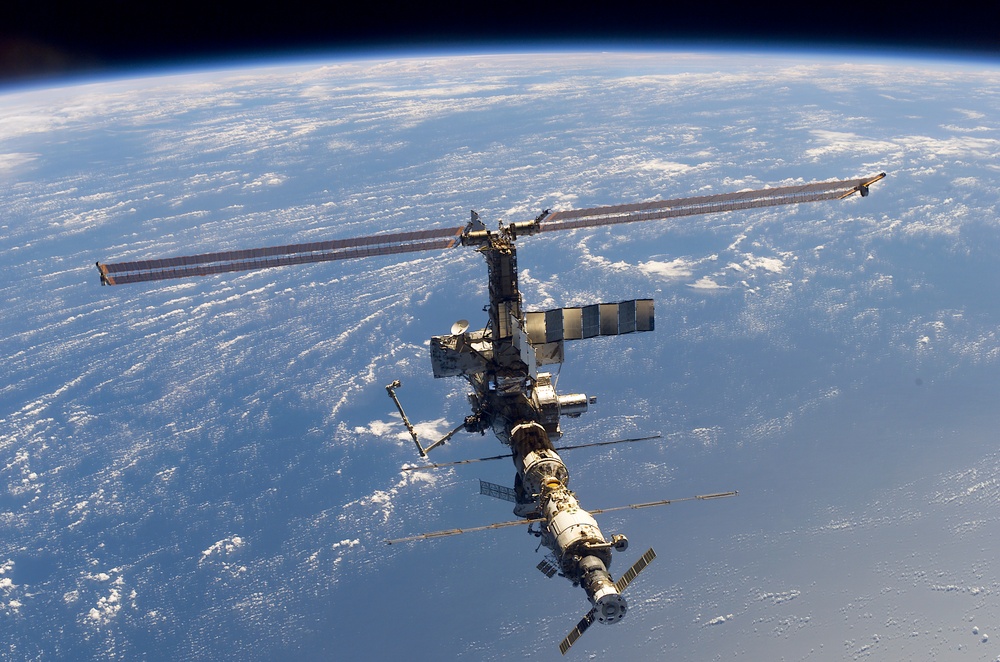 Aft - zenith view of the ISS taken during STS-110's undocking and final flyaround