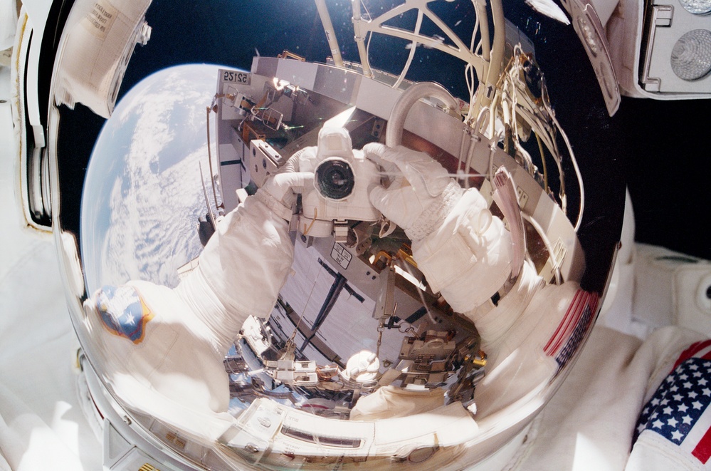 MS Tanner takes a picture of himself in his visor during an EVA of STS-97
