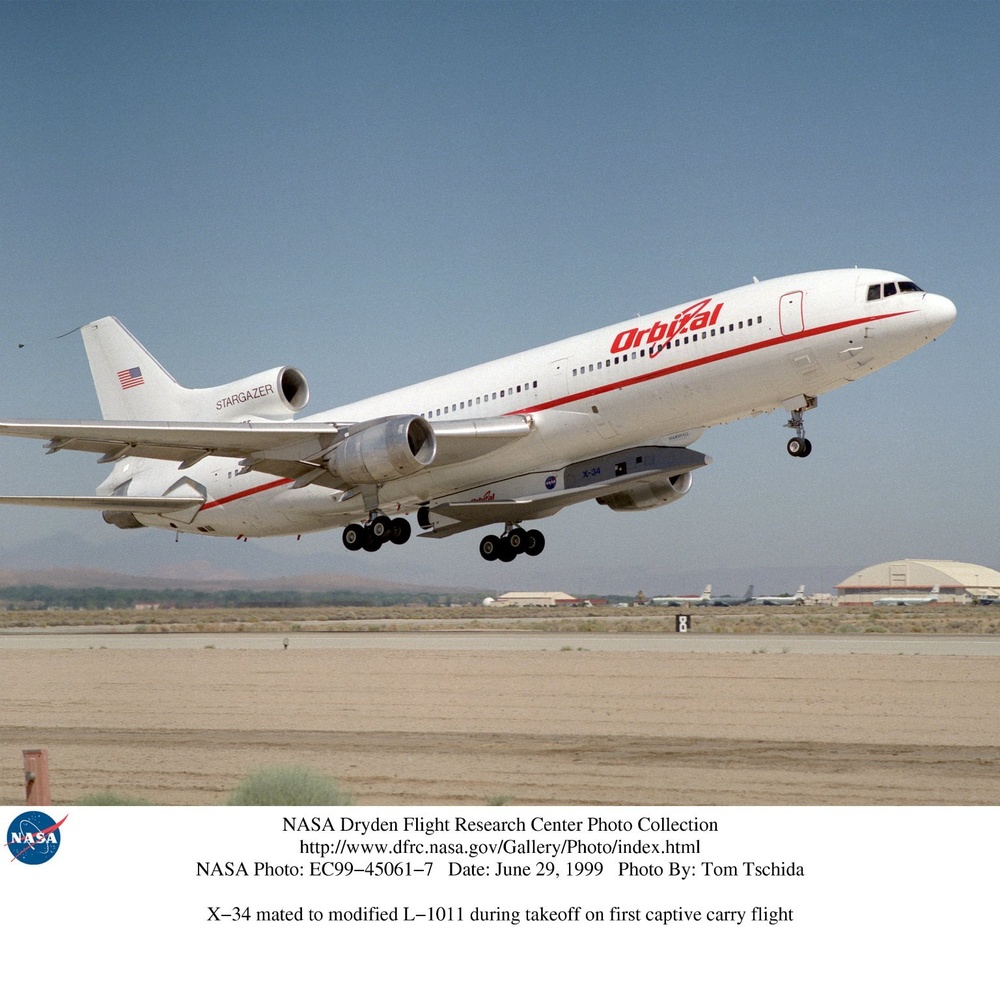 X-34 mated to modified L-1011 during takeoff on first captive carry flight