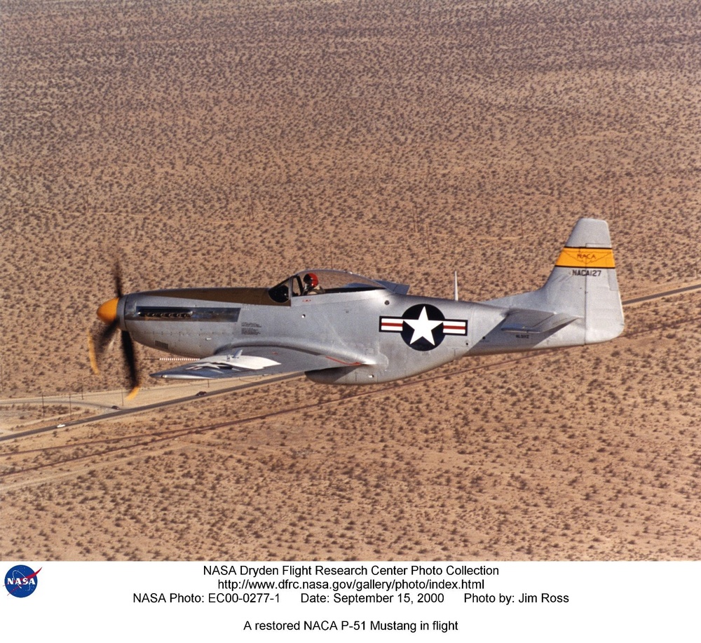 A restored NACA P-51 Mustang in flight