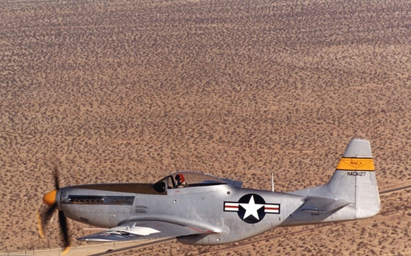 A restored NACA P-51 Mustang in flight