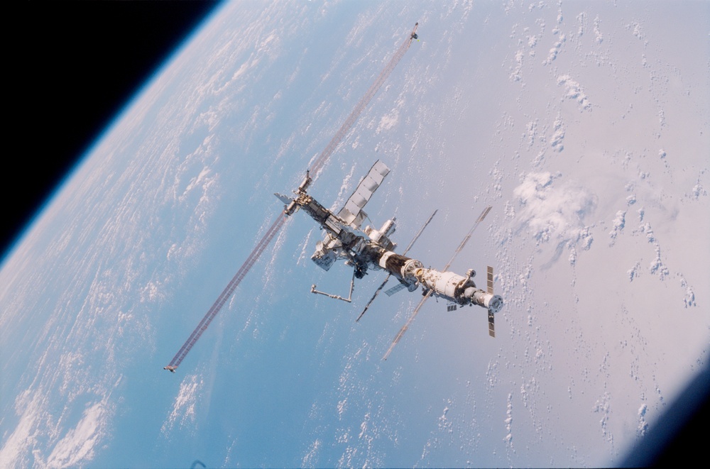 Aft - zenith view of the ISS taken during STS-110's undocking and final flyaround