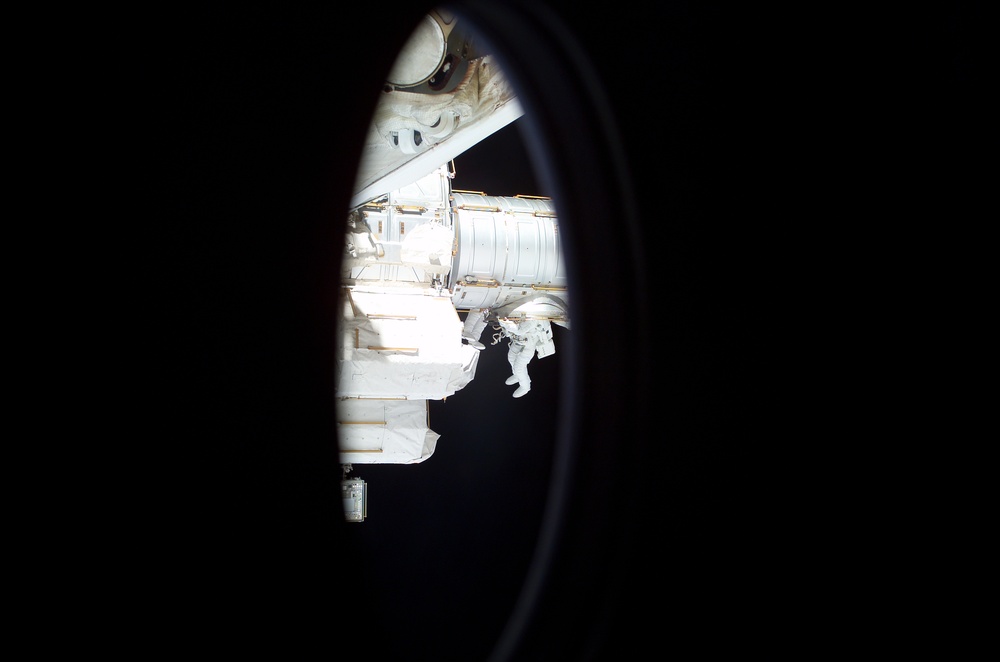 Walheim exits the Airlock to begin the first EVA of STS-110