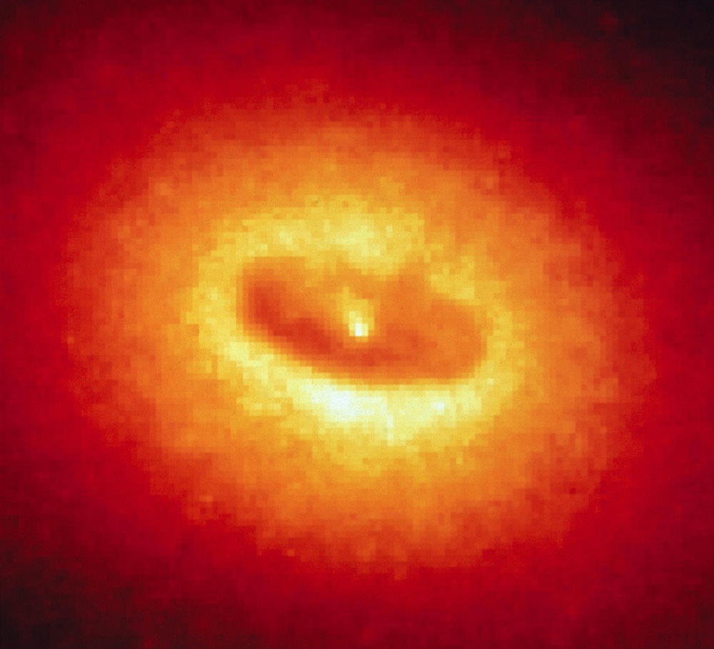 NASA's Hubble Space Telescope Discovers a Disk Fueling a Possible Black Hole