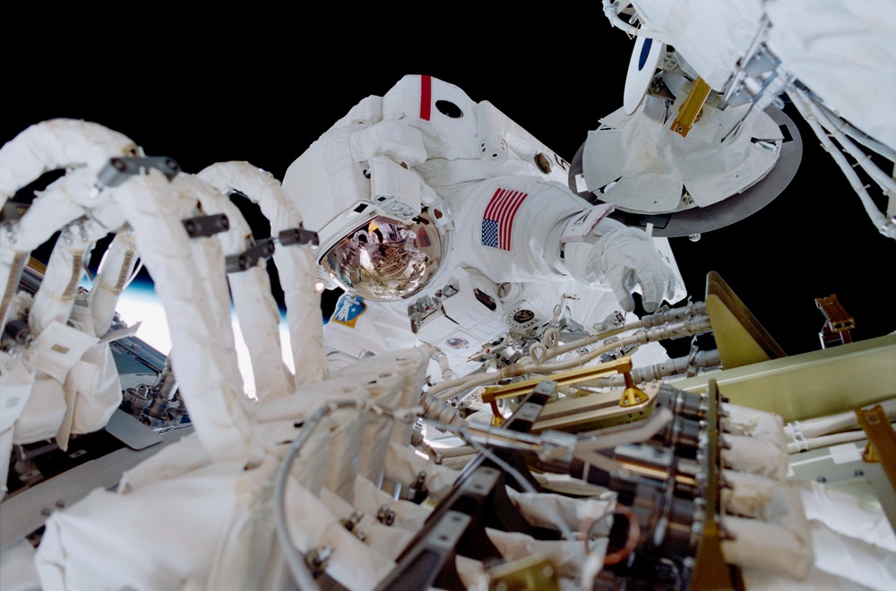 MS Jones installs cables and connectors on U.S. Laboratory / Destiny module