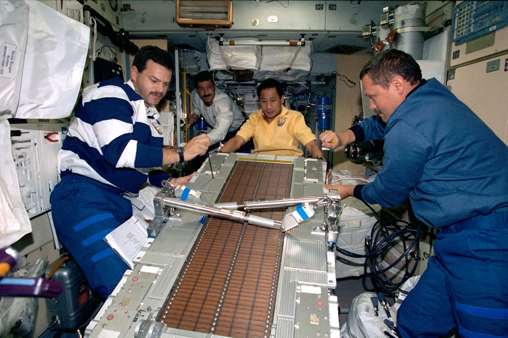 Lu, Morukov, Burbank and Altman install TVIS in Zvezda during STS-106
