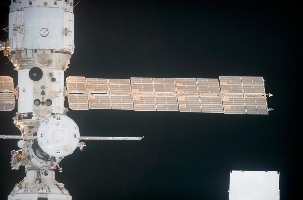 Soyuz vehicle, FGB and SM as the orbiter Discovery moves in for docking during STS-121