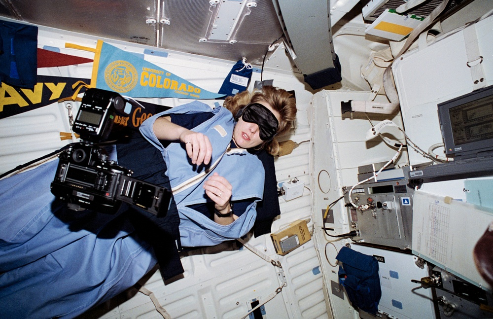 Davis and Reightler in their sleep restraints on middeck