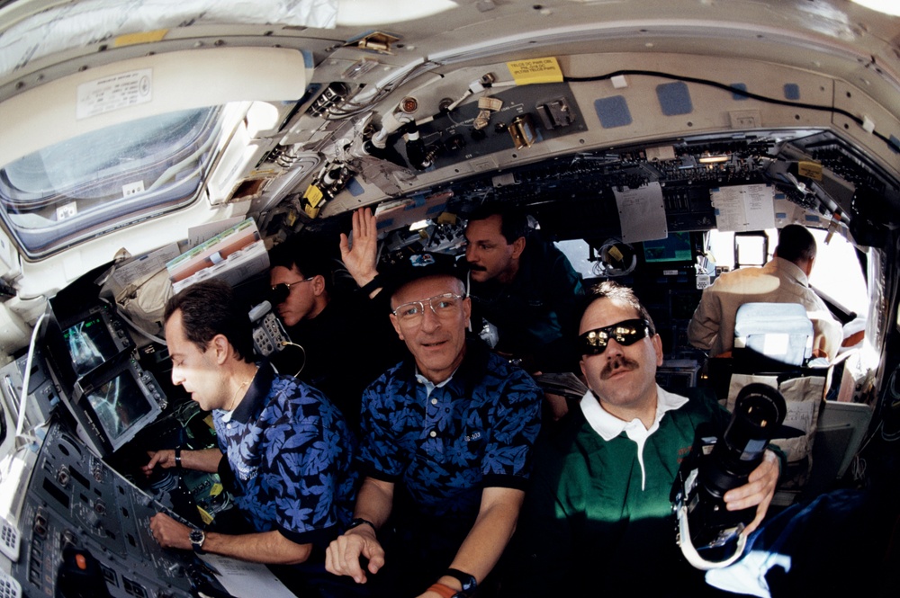 Various view with fish-eye lens of STS-103 crew on aft flight deck