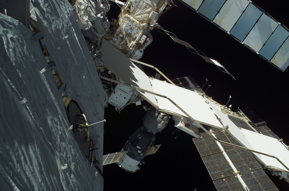 EVA view of the P1 Truss aft radiator and port side of the P6 Truss and Z1 Truss during STS-115 mission