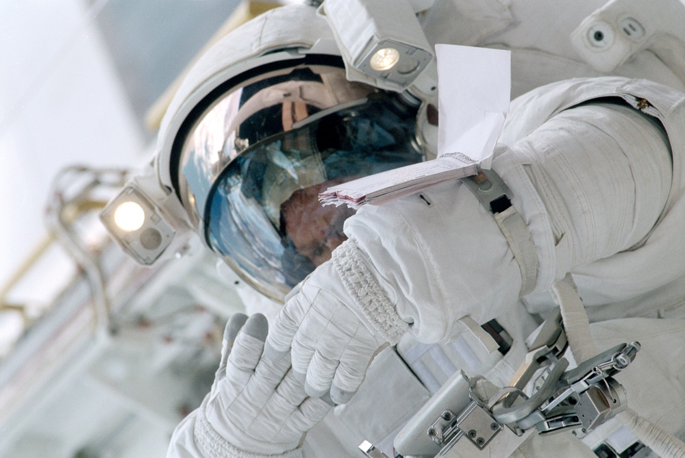 Close views of Andrew S.W. Thomas during an EVA