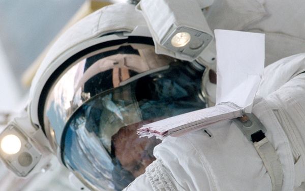 Close views of Andrew S.W. Thomas during an EVA