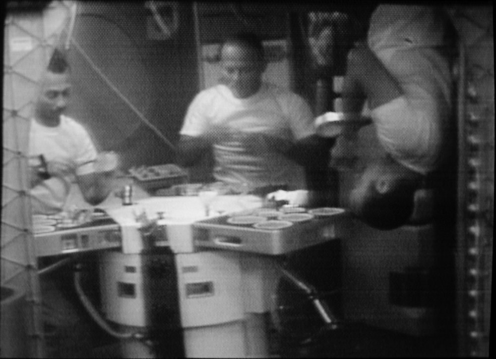 Skylab 3 crewmen shown eating in Orbital Workshop wardroom
