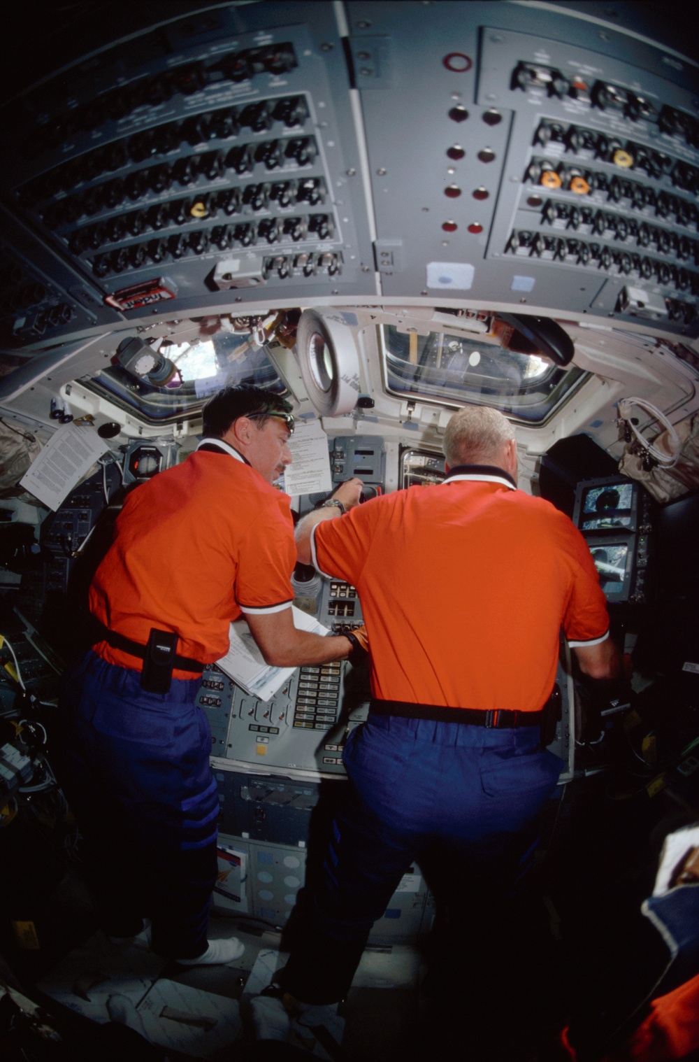 Forrester and Horowitz at the aft flight deck unberthing the MPLM from payload bay