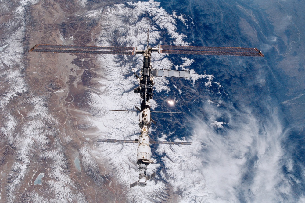 Various views of the ISS during flyaround backdropped by the Earth