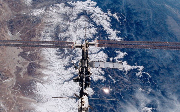 Various views of the ISS during flyaround backdropped by the Earth