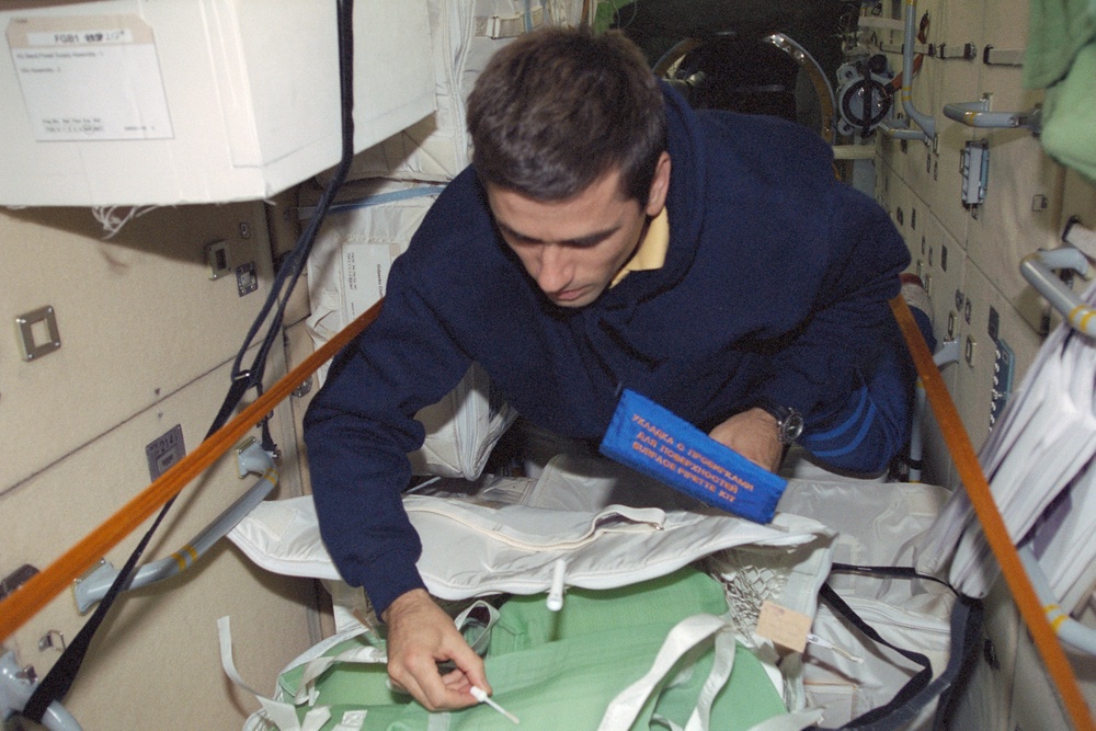 MS Malenchenko works with a stowage bag in Zarya during STS-106
