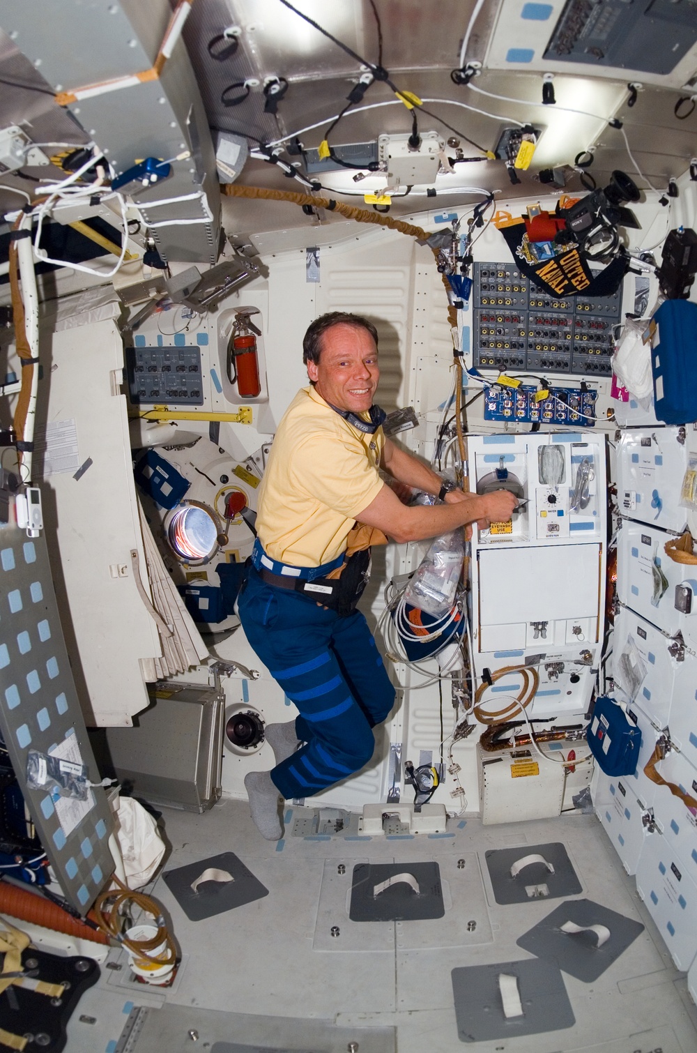 STS-116 MS Fuglesang prepares meal in the FWD MDDK on Space Shuttle Discovery