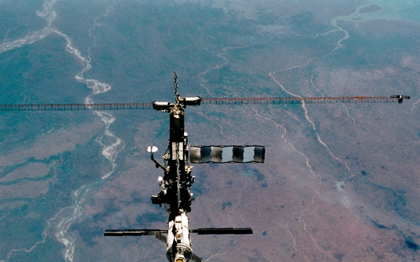 Various views of the ISS during flyaround backdropped by the Earth