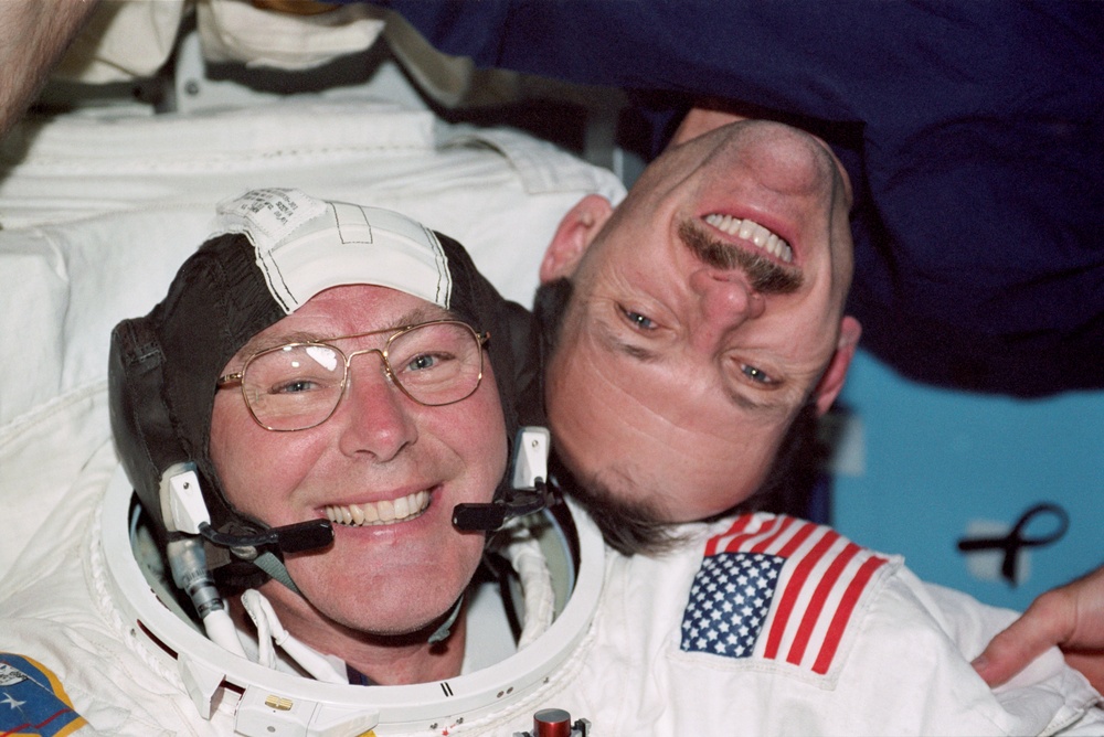 Ross and Smith pose in the Airlock prior to the second EVA of STS-110