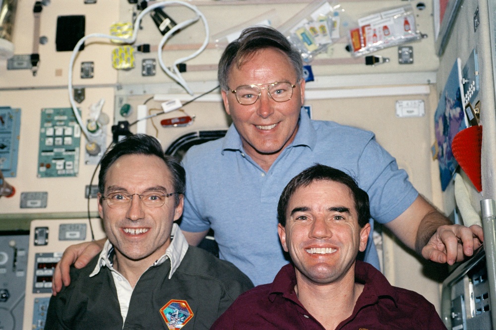 Walz, Ross and Walheim pose in the Service Module during STS-110