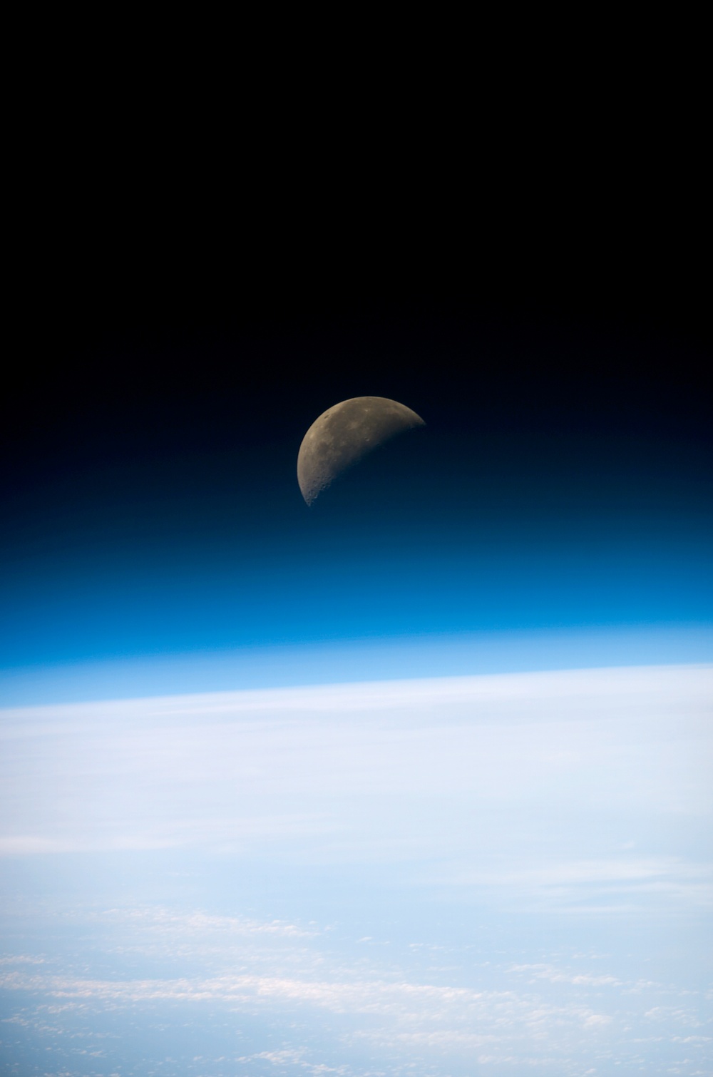 Moon set below the Earth's limb taken during STS-107