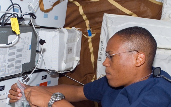 View of Drew working with FDF Accessory Kit in the MDDK during STS-118