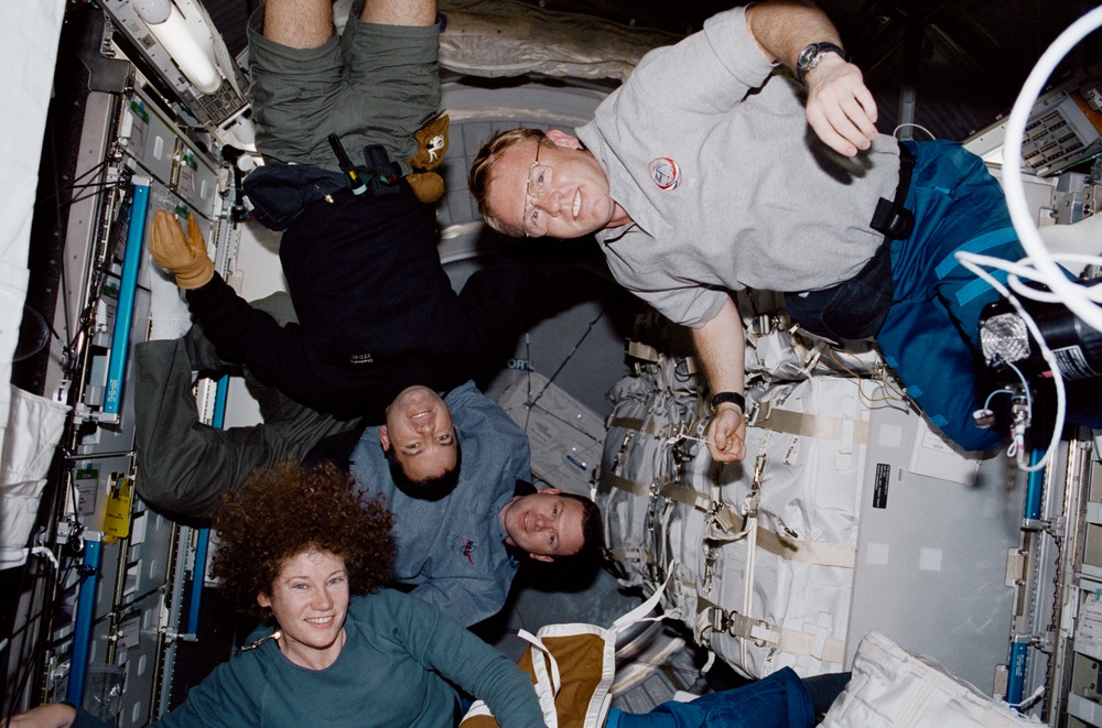 STS-102 Crewmember group activity in the Middeck and ISS MPLM/Leonardo
