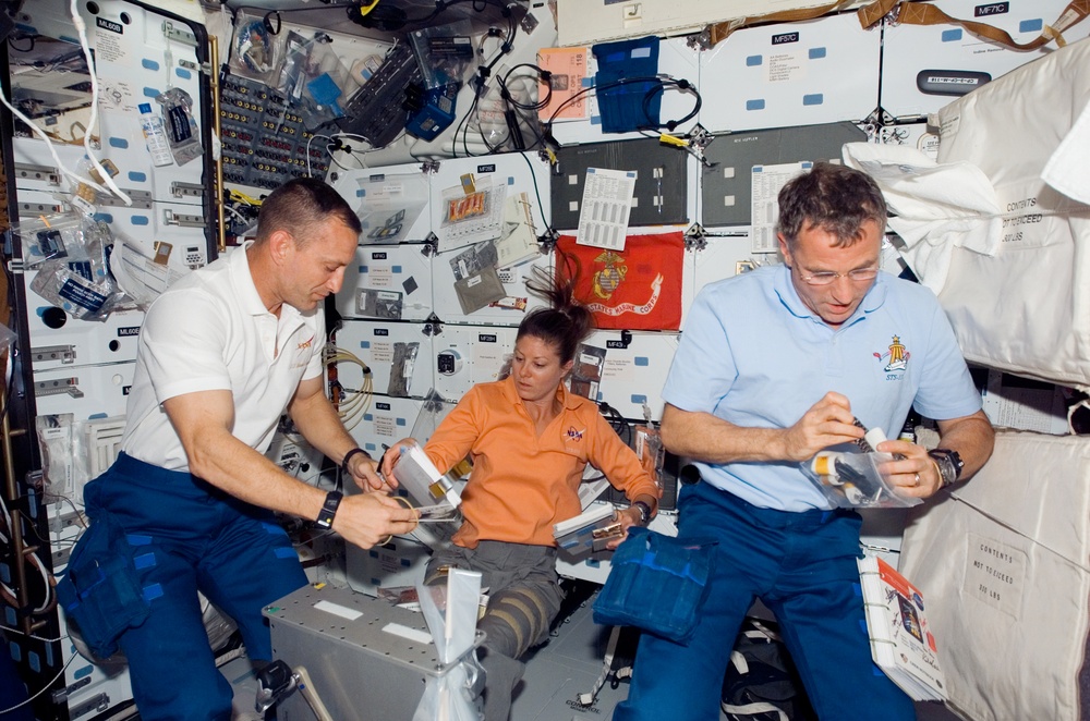 View of Crewmembers in the MDDK of the Shuttle Endeavour during STS-118