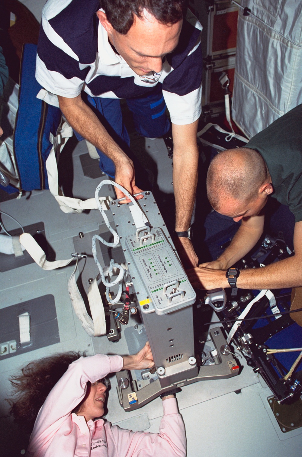 Various views of the STS-88 crew on the flight deck and middeck