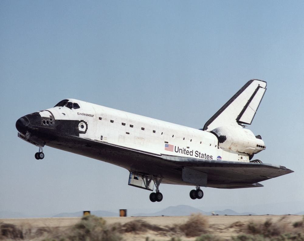 Profile view of Endeavour prior to touching down at Edwards AFB during STS-100's landing