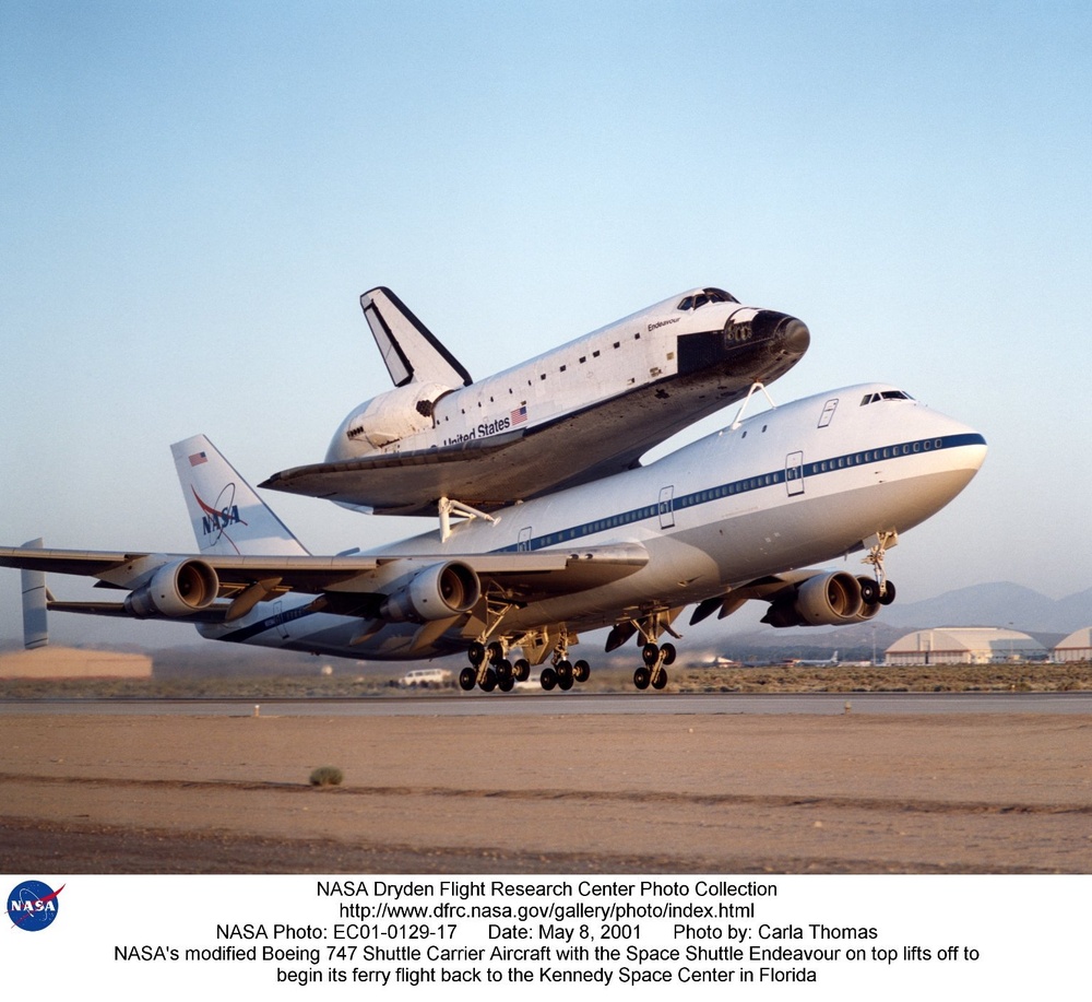 NASA's modified Boeing 747 Shuttle Carrier Aircraft with the Space Shuttle Endeavour on top lifts of