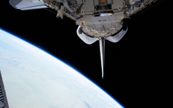 WSF, view of satellite on RMS arm during deployment procedures