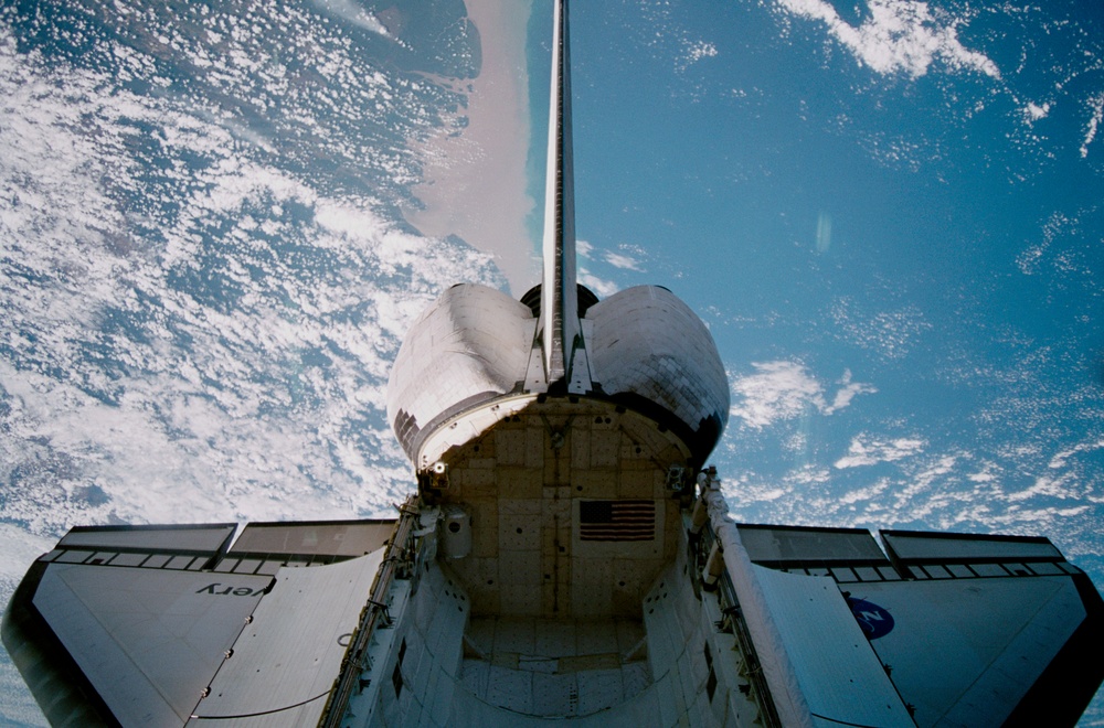 The orbiter payload bay is photographed from U.S. Laboratory