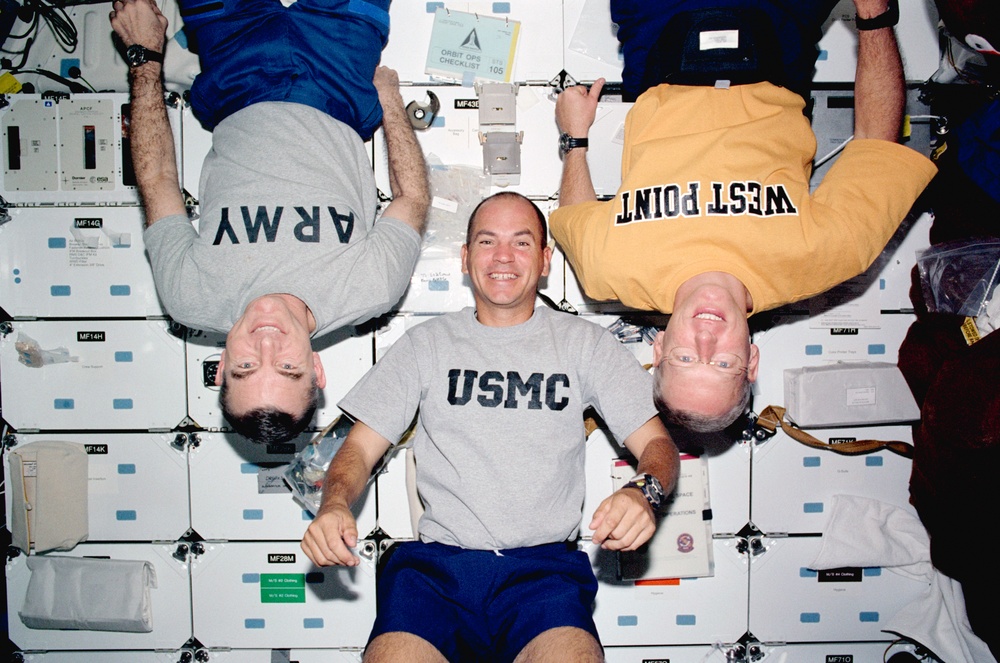 Voss wearing Army shirt, Sturckow wearing USMC shirt and Forrester wearing West Point shirt