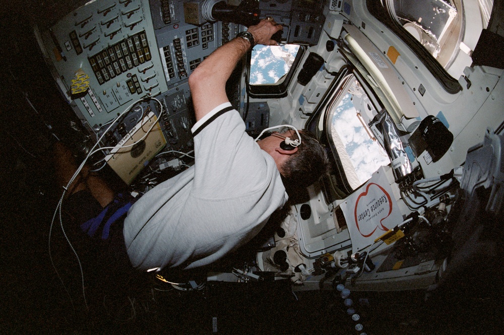 McArthur poses at aft flight deck; McArthur and Chiao at aft flight deck