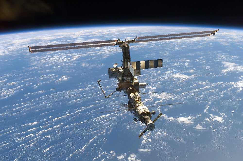 Aft - zenith view of the ISS taken during STS-110's undocking and final flyaround