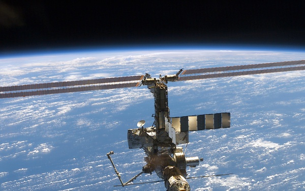 Aft - zenith view of the ISS taken during STS-110's undocking and final flyaround