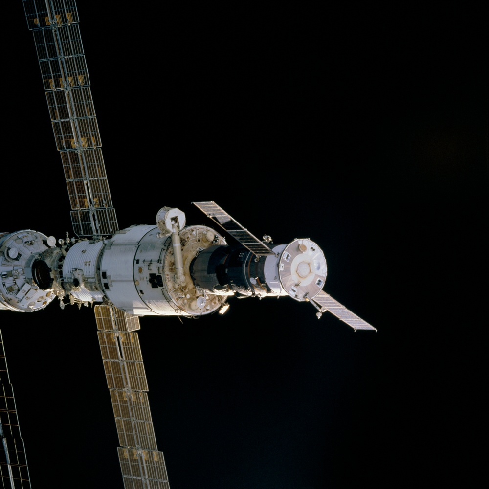 View of Zvezda and Progress during the initial fly around of STS-106