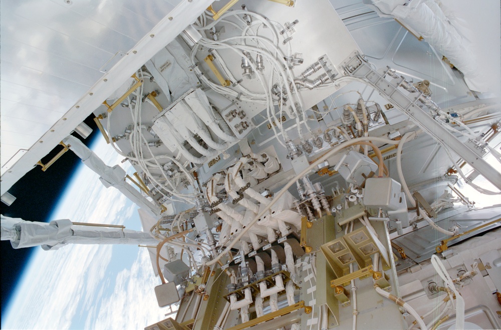 View of the aft avionics tray between the Z1 and S0 Trusses taken during the fourth EVA of STS-110