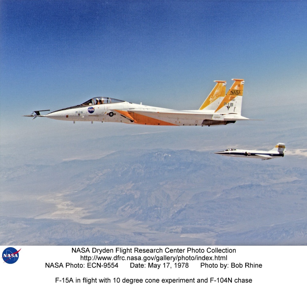 F-15A in flight with 10 degree cone experiment and F-104N chase