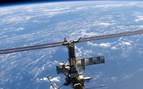 Aft - zenith view of the ISS taken during STS-110's undocking and final flyaround