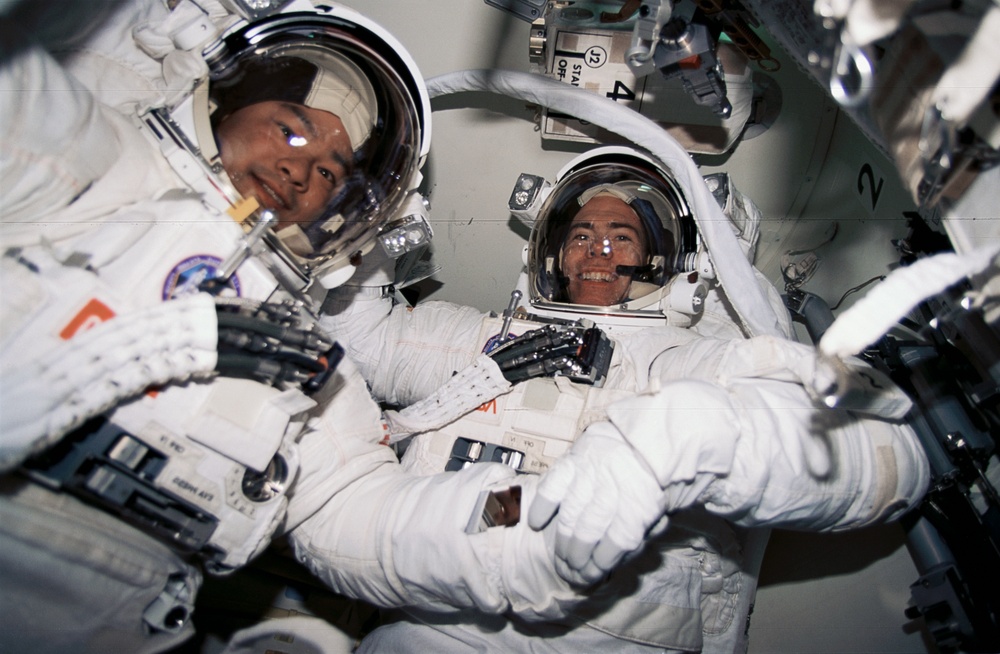 EMU suited crewmembers prepare for first EVA of STS-72 mission