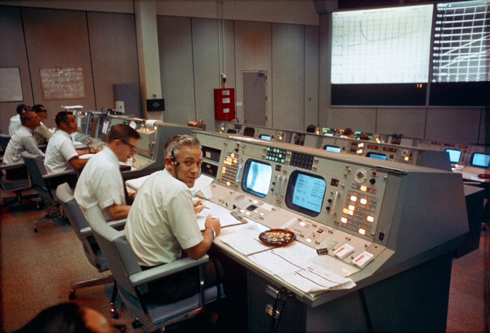 Apollo/Saturn 203 Flight Director John D. Hodge at his console during the mission