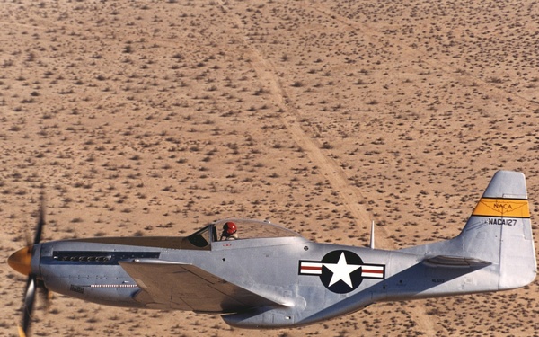 A restored NACA P-51 Mustang in flight