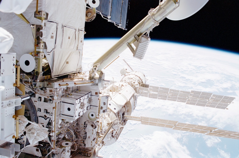 View of the port side of the Z1 Truss, Zarya and Zvezda taken during the first EVA of STS-100